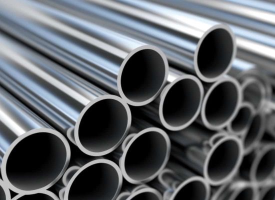 Close-up of bundled, polished metal pipes with circular openings facing forward, reflecting light; high-quality piping materials by Pipeworks Plumbing and Construction, used for professional plumbing and construction projects. Close-up of bundled, polished metal pipes with circular openings facing forward, reflecting light; high-quality piping materials by Pipeworks Plumbing and Construction, used for professional plumbing and construction projects.